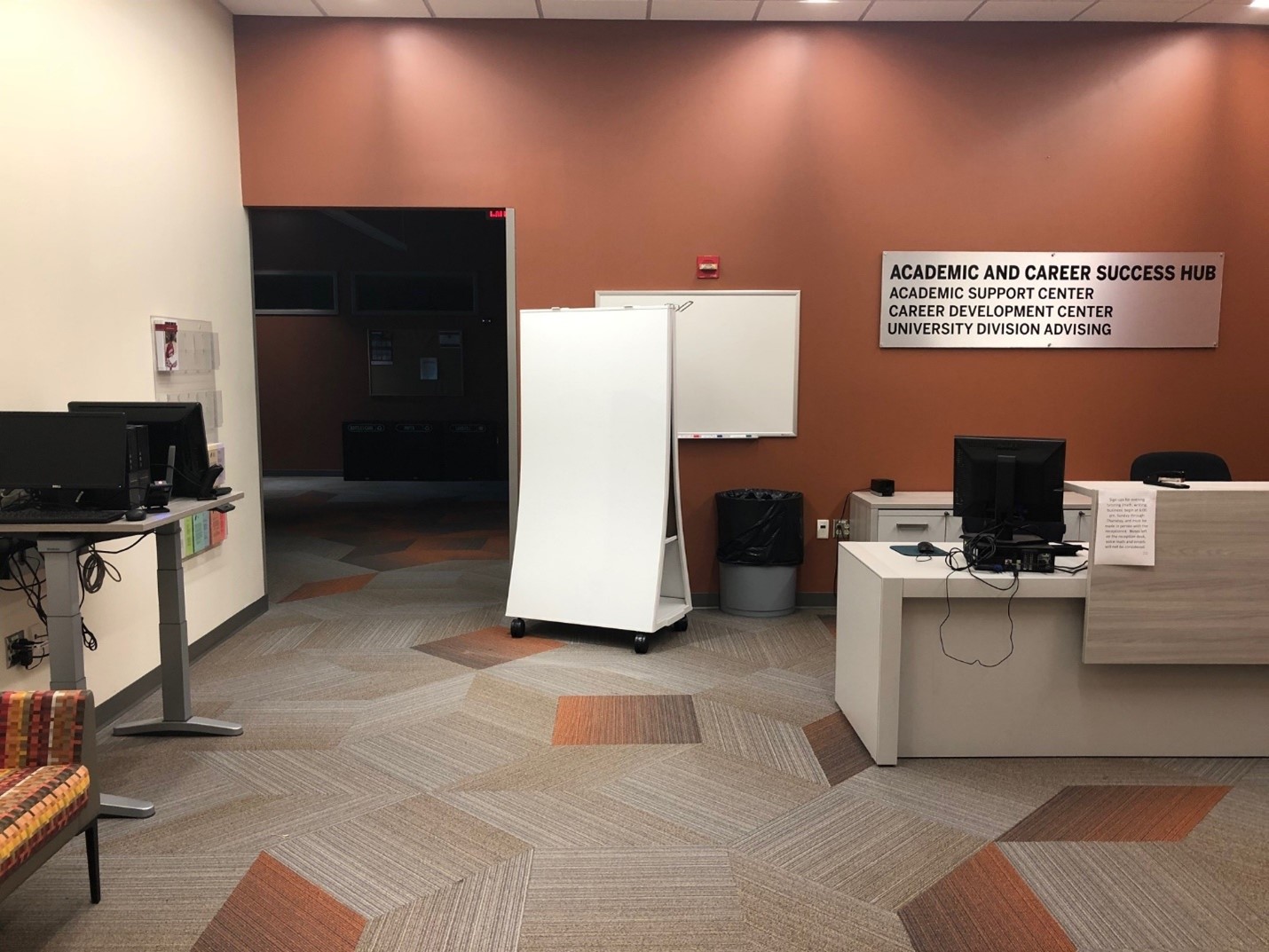 Academic and Career Success Hub lobby. There is a check-in desk in the center of the room.