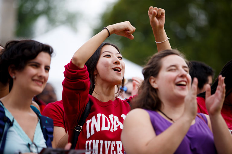 Students smiling and clapping at an event for the Culture Festival at Indiana University